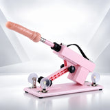 Pink A2 thrusting sex machine with a realistic attachment installed, adjustable frame and suction cup base