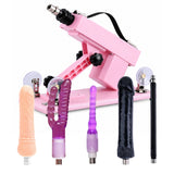Pink A2 thrusting sex machine with five accessories including black dildo, standard dildo, double-ended dildo, anal plug and extension rod